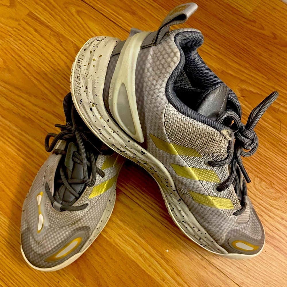 Super cool unique grey and gold Adidas basketball shoes.